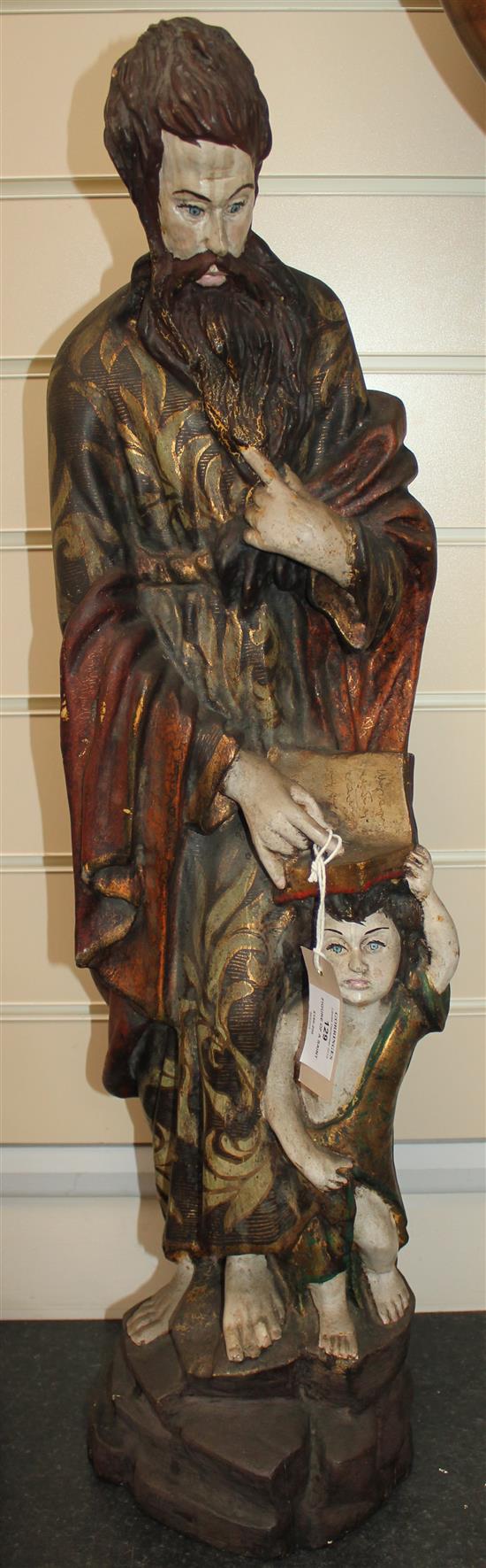 A 20th century carved and polychrome painted figure of a Saint, 31in.